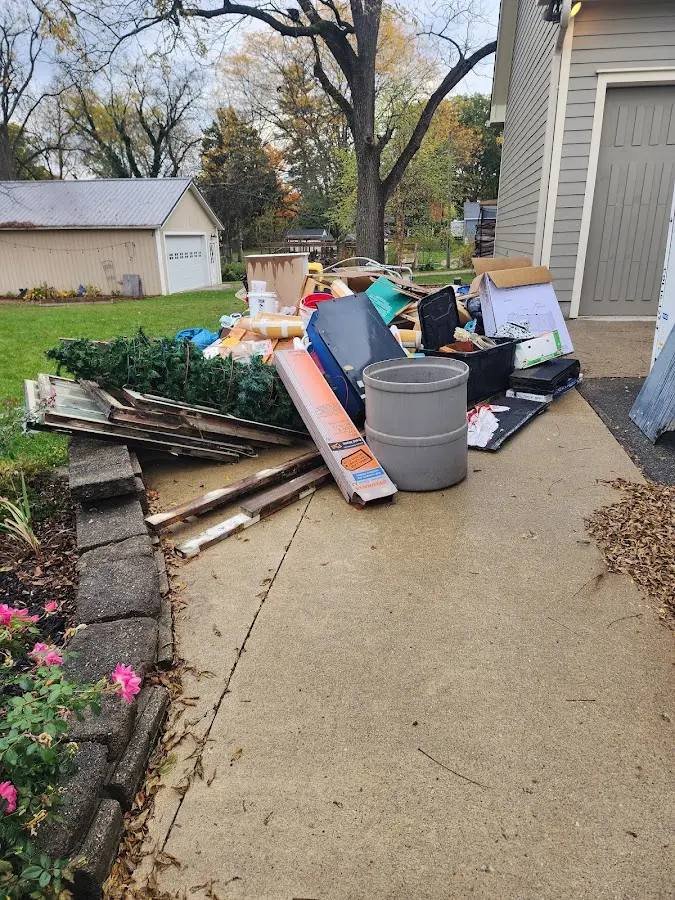 Dumpster being loaded with debris for Estate Cleanout Dumpster Rental in Portsmouth